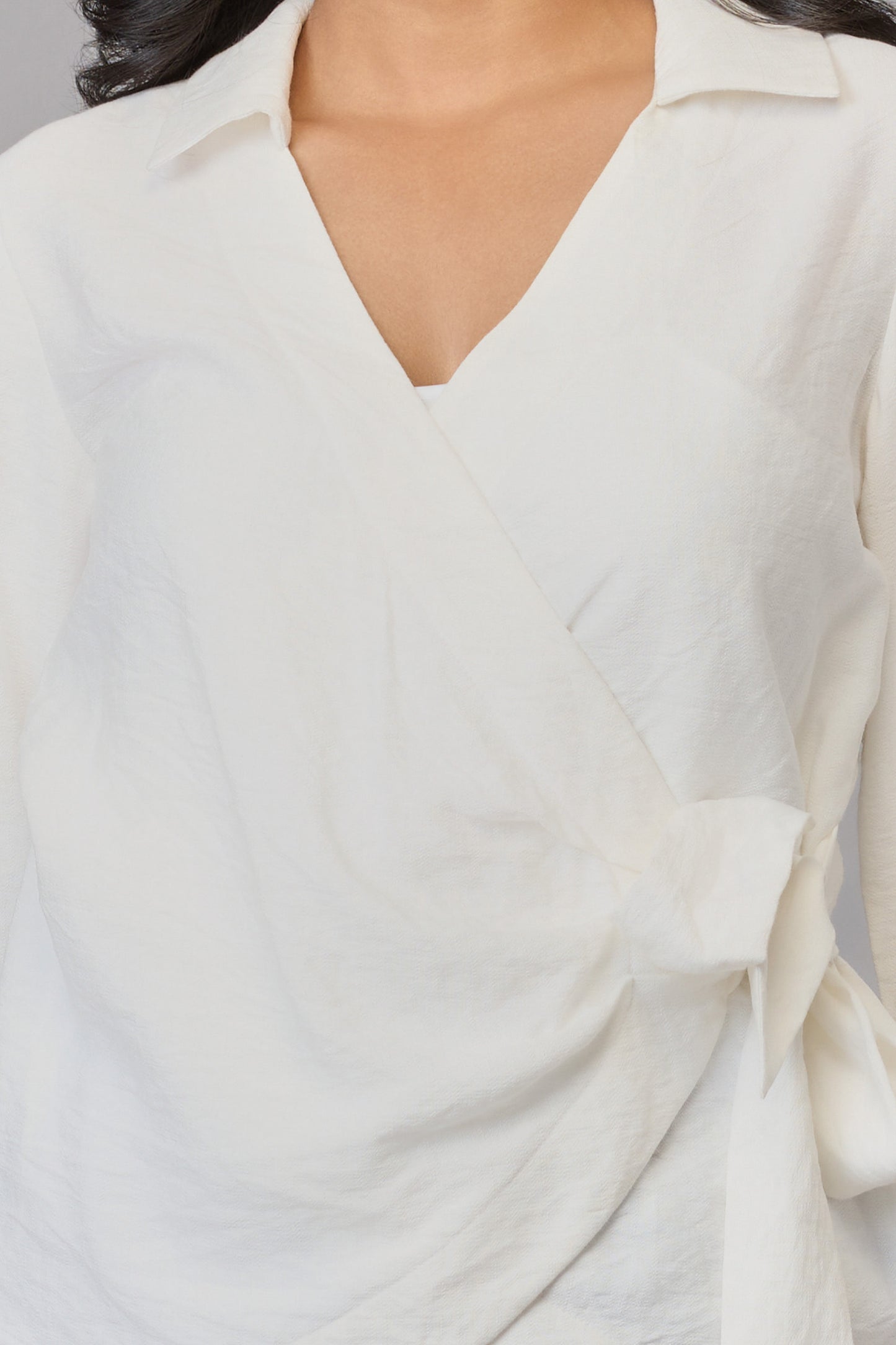 Mira’s White Wrap-Front Top
